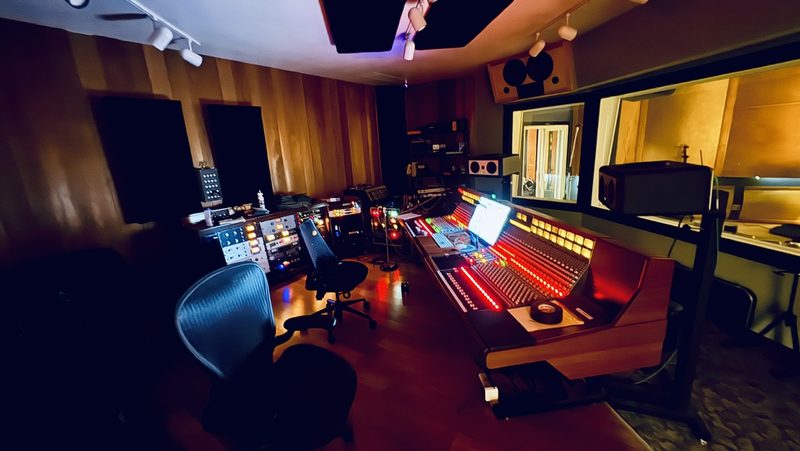 The control room at Sharkbite Studios in Oakland, large console lit up.